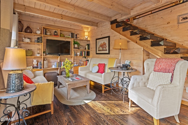 living room with wooden ceiling, wood walls, wood finished floors, stairway, and beam ceiling