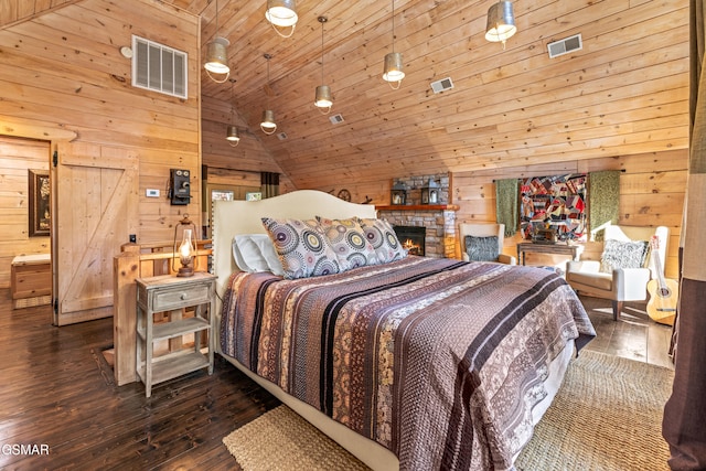 bedroom featuring lofted ceiling, visible vents, and wooden walls