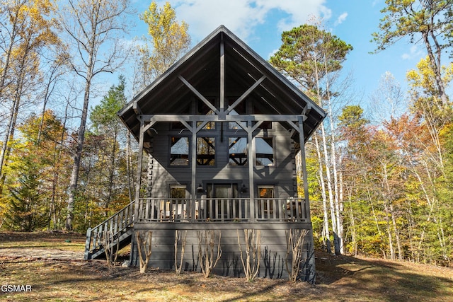 view of front of property featuring stairway