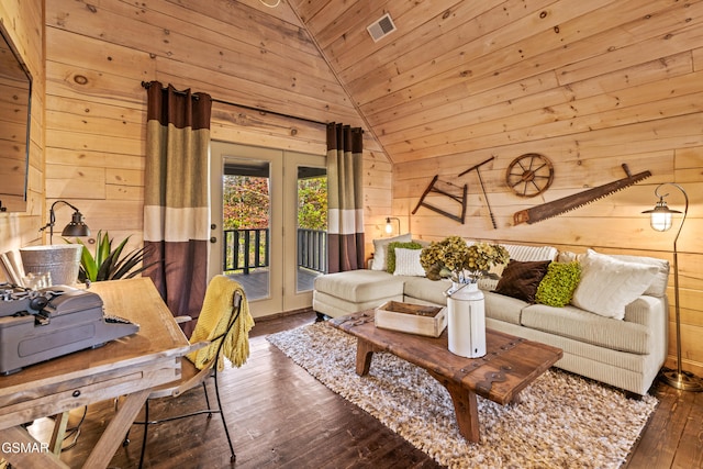 living area with wooden walls, visible vents, lofted ceiling, wooden ceiling, and wood-type flooring