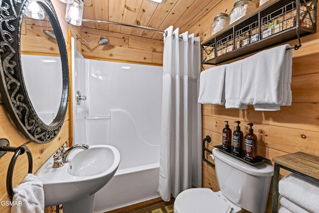 full bath featuring shower / tub combo with curtain, toilet, wood ceiling, a sink, and wooden walls