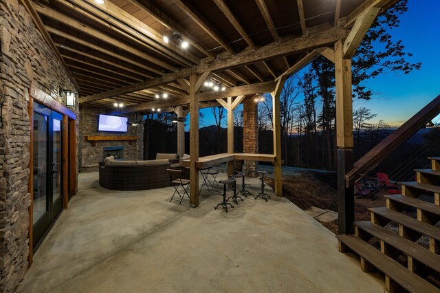 view of patio / terrace with an outdoor stone fireplace