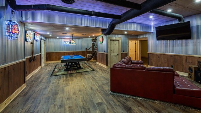 rec room featuring wooden walls, wood-type flooring, and billiards