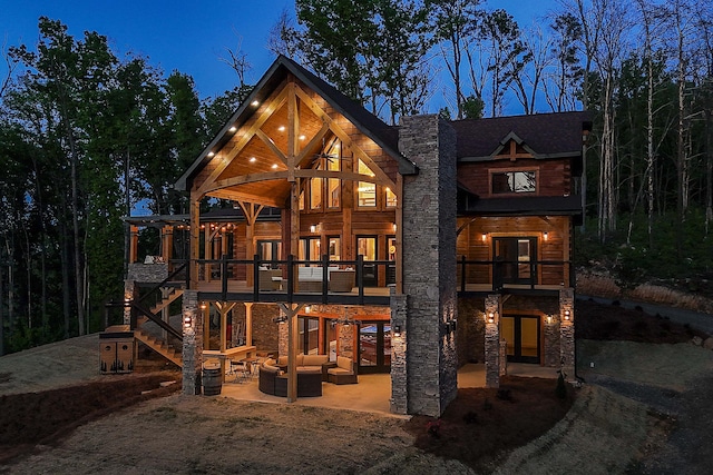 view of front of home featuring an outdoor living space and a patio area