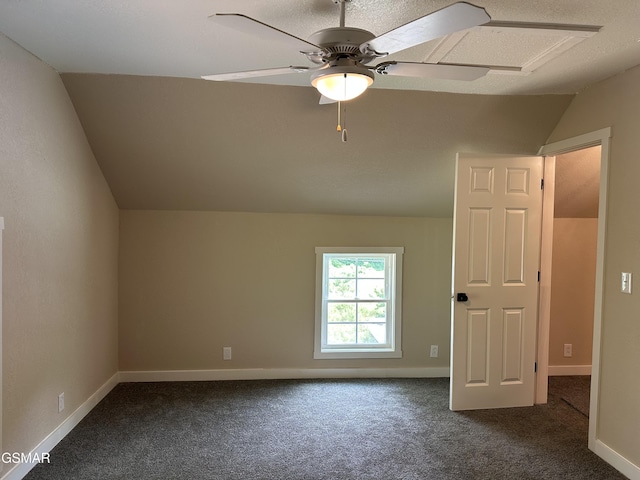 3979 Wilhite Rd, Sevierville, TN 37876 - additional living space with vaulted ceiling, dark carpet, and a ceiling fan