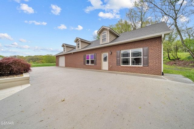 225 Piney Rd, Kodak, TN 37764 - cape cod-style house featuring brick siding and roof with shingles