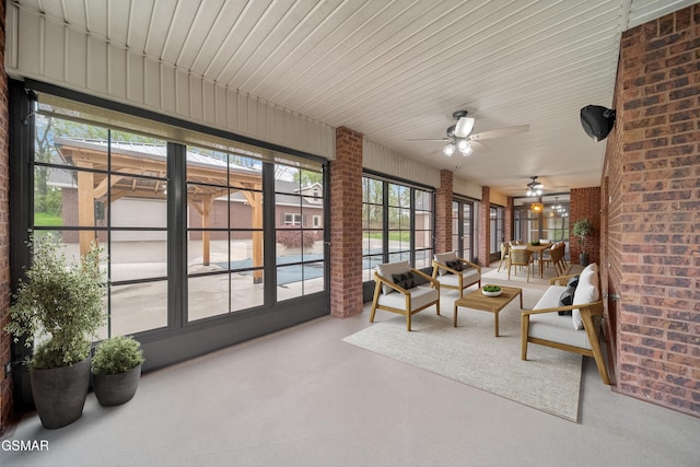 225 Piney Rd, Kodak, TN 37764 - sunroom with brick wall, french doors, and finished concrete floors