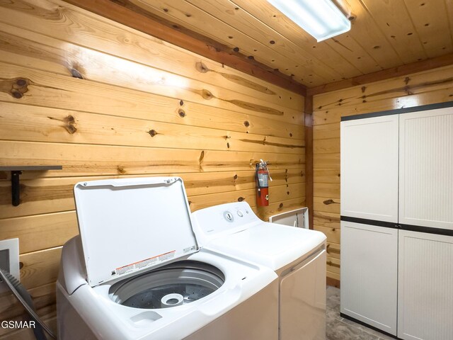 2316 Boulder Way, Sevierville, TN 37862 - laundry room with cabinet space, wood walls, washing machine and dryer, and wood ceiling