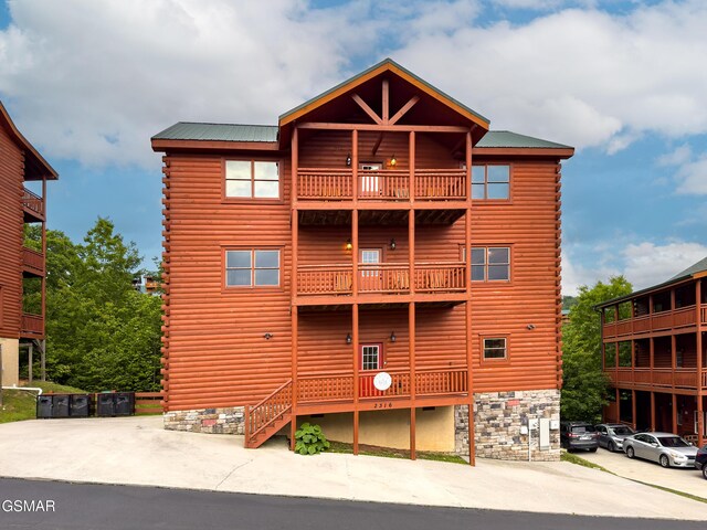 2316 Boulder Way, Sevierville, TN 37862 - back of property with a balcony and log exterior