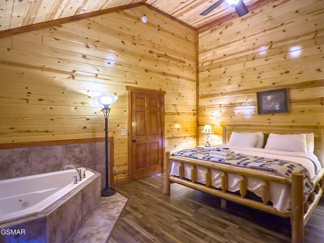 2316 Boulder Way, Sevierville, TN 37862 - bedroom with wooden walls, wood ceiling, and dark wood-style flooring