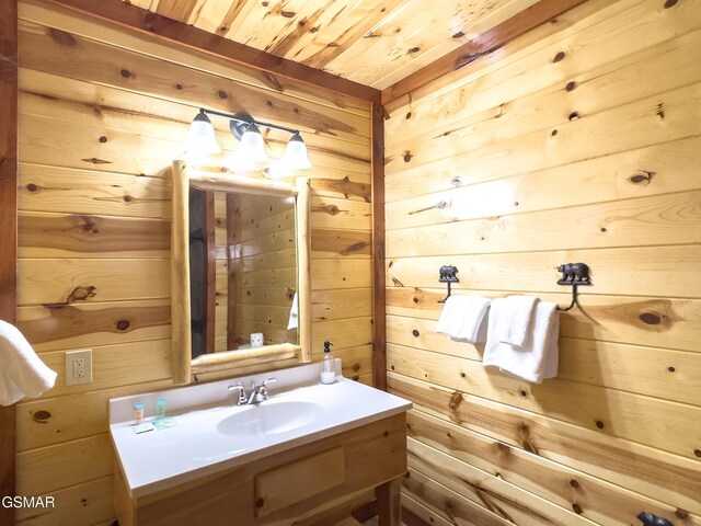 2316 Boulder Way, Sevierville, TN 37862 - bathroom with wood walls, wood ceiling, and vanity