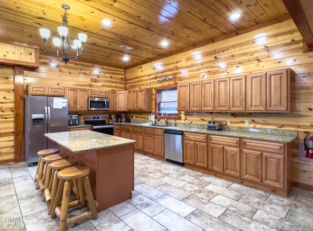 2316 Boulder Way, Sevierville, TN 37862 - kitchen featuring stainless steel appliances, a sink, wooden ceiling, brown cabinets, and a chandelier