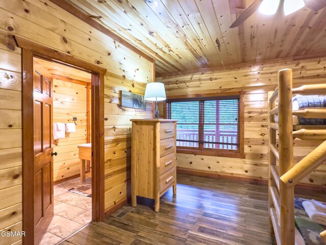 2316 Boulder Way, Sevierville, TN 37862 - unfurnished bedroom with dark wood finished floors, wood ceiling, and wood walls