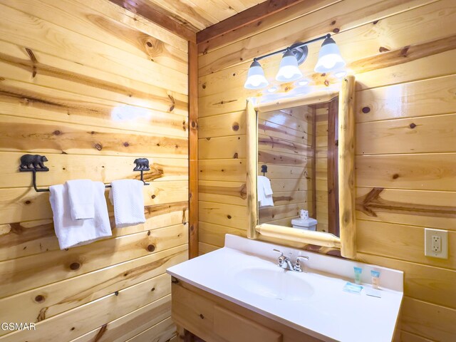 2316 Boulder Way, Sevierville, TN 37862 - bathroom featuring wooden walls and vanity