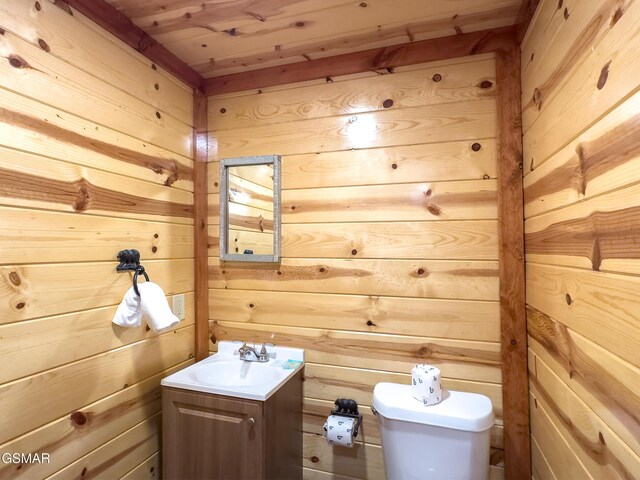 2316 Boulder Way, Sevierville, TN 37862 - half bathroom featuring wood walls, toilet, and vanity