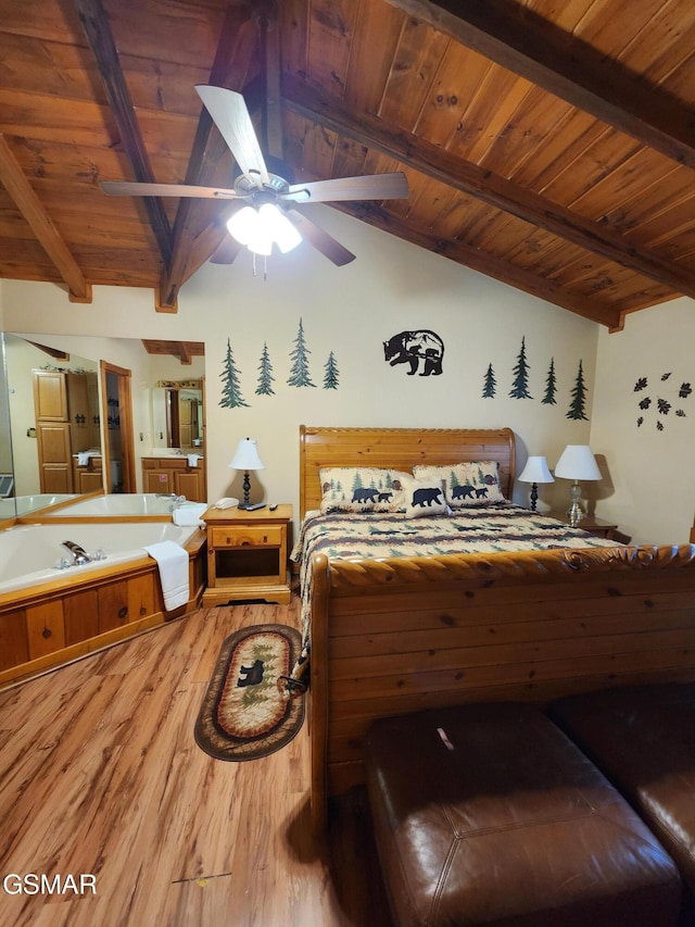 bedroom with lofted ceiling with beams, hardwood / wood-style flooring, ceiling fan, and wooden ceiling