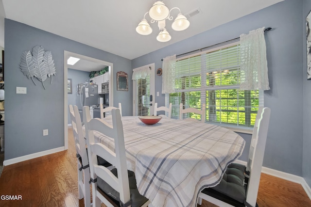 523 Apple View Way Unit 409, Sevierville, TN 37862 - dining room with wood finished floors and a chandelier