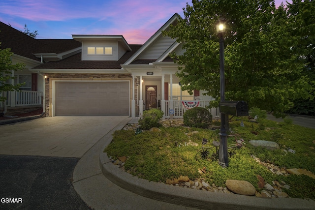 523 Apple View Way Unit 409, Sevierville, TN 37862 - view of front of house featuring driveway, a porch, and a garage