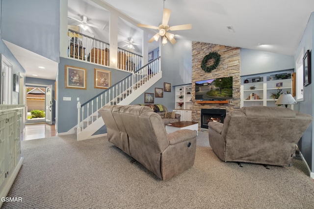 523 Apple View Way Unit 409, Sevierville, TN 37862 - living room with a fireplace, carpet floors, stairs, high vaulted ceiling, and ceiling fan