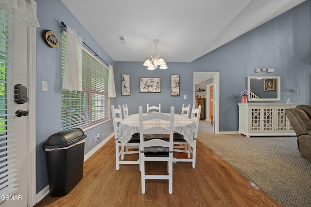 523 Apple View Way Unit 409, Sevierville, TN 37862 - dining room with a chandelier, vaulted ceiling, and wood finished floors
