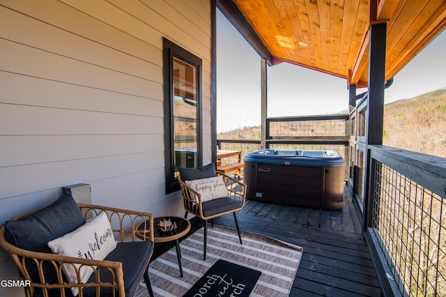 deck featuring a hot tub
