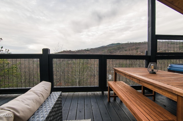 wooden terrace featuring a mountain view