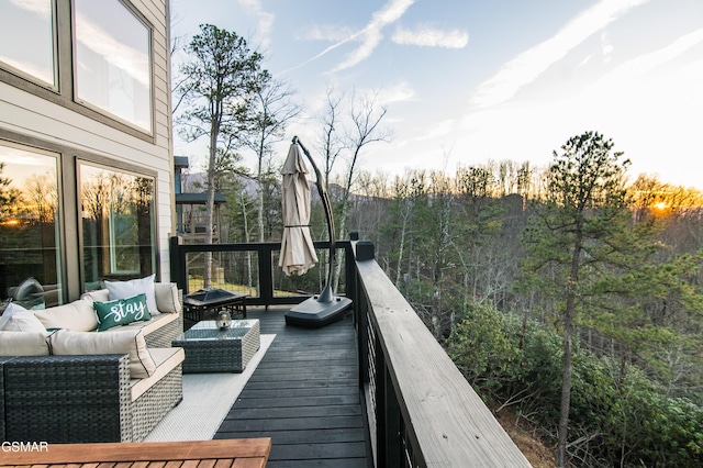 wooden deck featuring outdoor lounge area