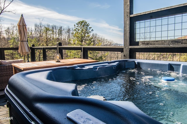 view of pool featuring a hot tub and a wooden deck
