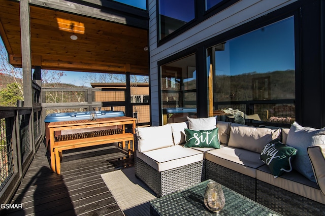 wooden terrace featuring outdoor lounge area