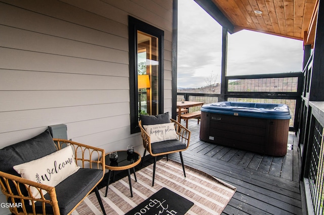 deck featuring a hot tub