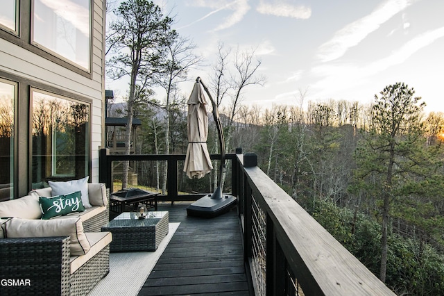 wooden deck featuring an outdoor living space