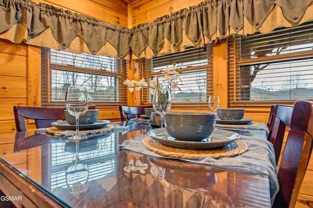 dining space with wooden walls