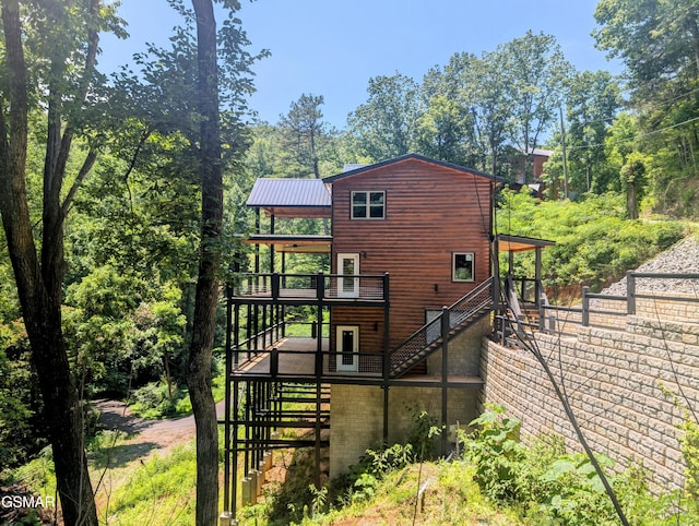 1130 Laddie Buck Ln, Gatlinburg, TN 37738 - rear view of property featuring stairs, a deck, and a metal roof