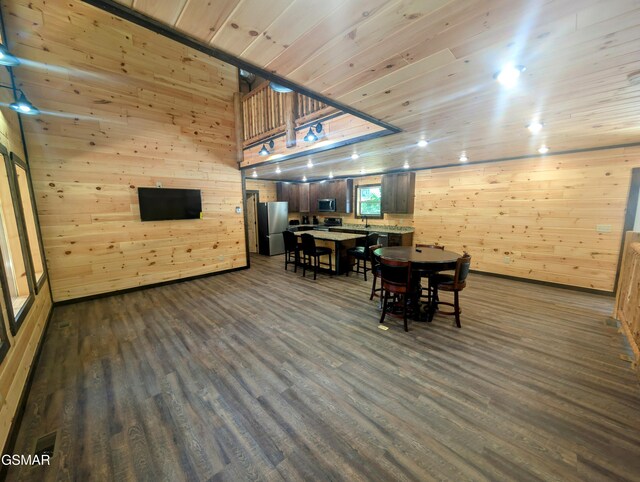 1130 Laddie Buck Ln, Gatlinburg, TN 37738 - dining room with dark wood-style flooring, wood walls, and wooden ceiling