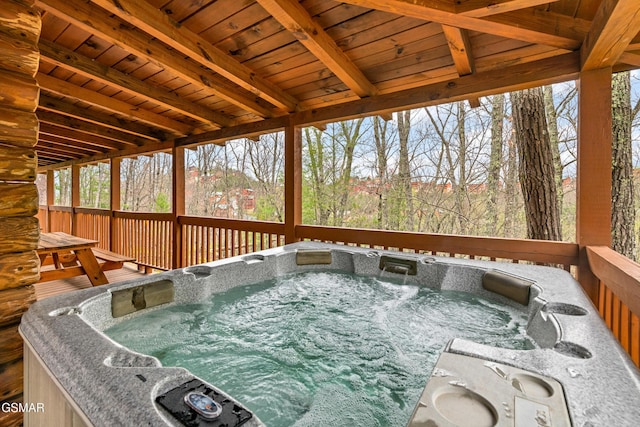 deck with a hot tub