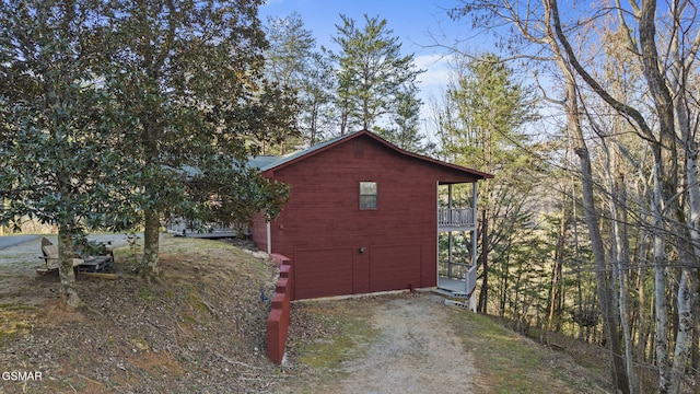 3430 Laurel Ridge Way, Sevierville, TN 37862 - view of home's exterior with dirt driveway, a balcony, and an attached garage