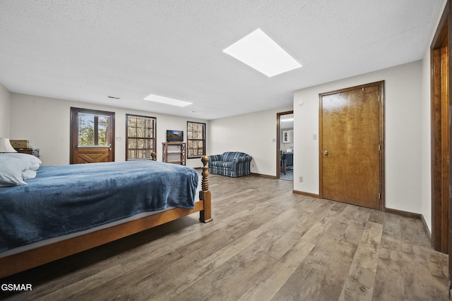 3430 Laurel Ridge Way, Sevierville, TN 37862 - bedroom with wood finished floors and a skylight