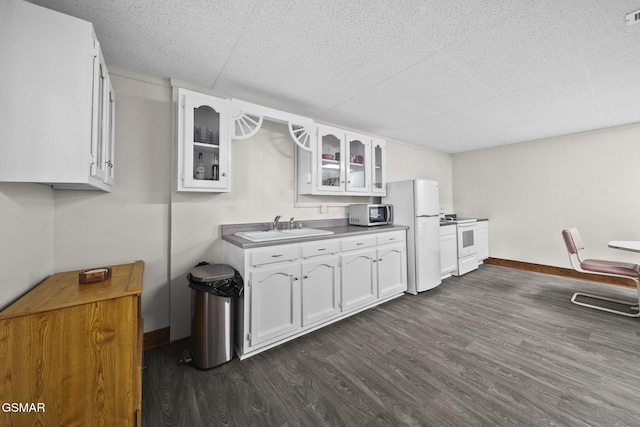 3430 Laurel Ridge Way, Sevierville, TN 37862 - kitchen with white appliances, a paneled ceiling, dark wood finished floors, white cabinets, and glass insert cabinets