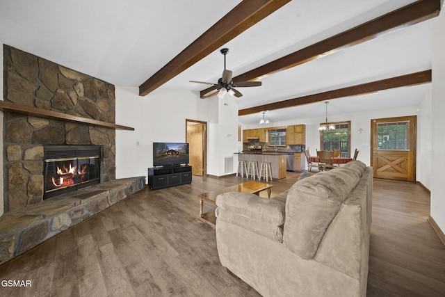 3430 Laurel Ridge Way, Sevierville, TN 37862 - living room with dark wood finished floors, a fireplace, a ceiling fan, a chandelier, and beam ceiling