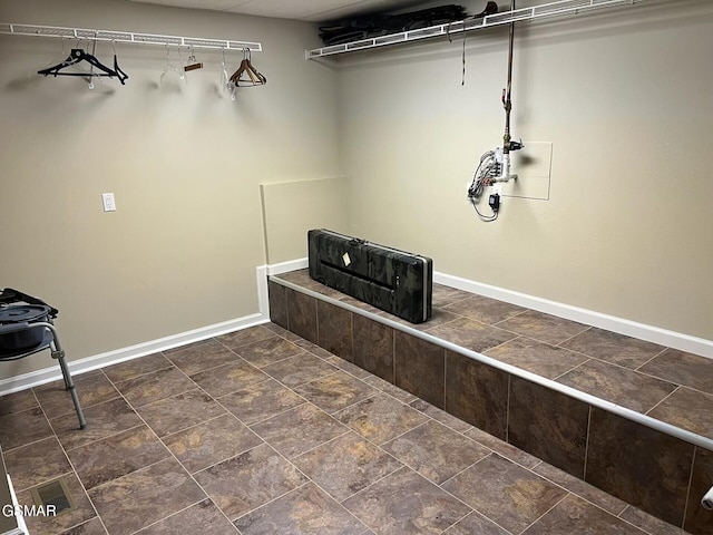 20 Brixton Ln, Crossville, TN 38555 - laundry area with baseboards and stone finish floor