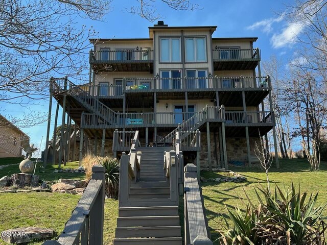 20 Brixton Ln, Crossville, TN 38555 - rear view of house with a yard, a balcony, and stairway