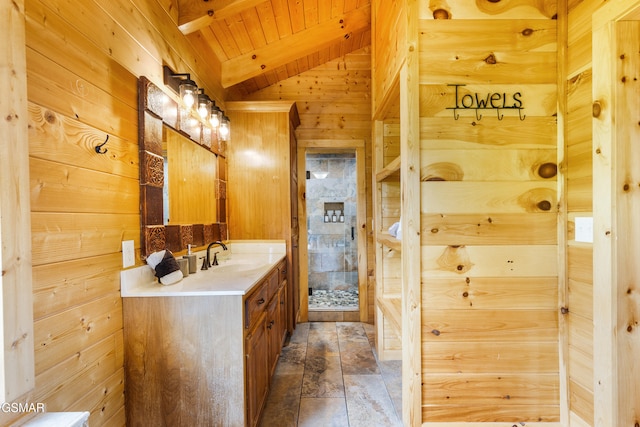 3391 Clear Valley Dr, Sevierville, TN 37862 - full bathroom featuring vanity, wooden ceiling, wood walls, and stone finish flooring