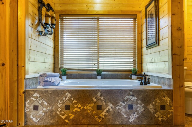 3391 Clear Valley Dr, Sevierville, TN 37862 - full bathroom with healthy amount of natural light, wooden walls, and a garden tub