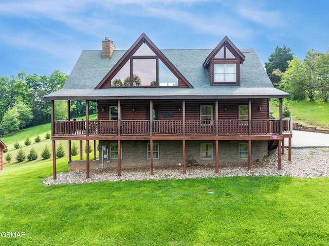 3391 Clear Valley Dr, Sevierville, TN 37862 - view of front of house with a front lawn, a deck, a chimney, and roof with shingles