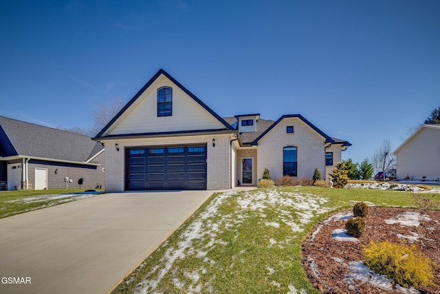 view of front facade with an attached garage, concrete driveway, and brick siding