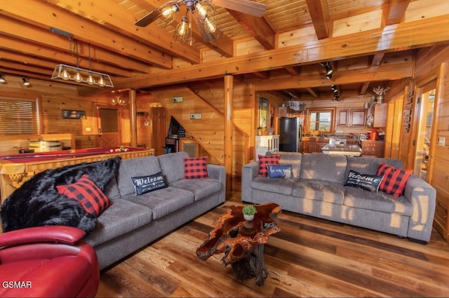 living room featuring beam ceiling, ceiling fan, hardwood / wood-style floors, wooden walls, and wood ceiling