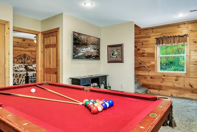 rec room with wooden walls, carpet, and pool table