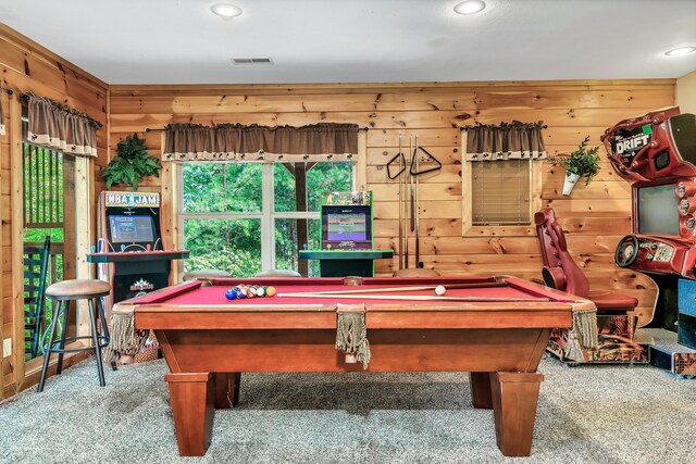 recreation room with carpet flooring, wooden walls, and pool table