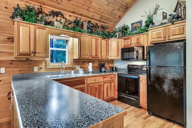 kitchen with wood ceiling, vaulted ceiling, sink, black appliances, and light hardwood / wood-style floors