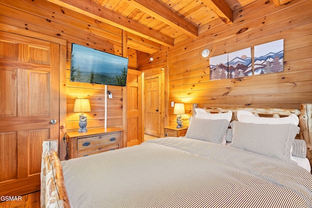 bedroom with wooden ceiling, beamed ceiling, and wood walls